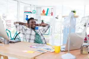 Male executive relaxing at his desk