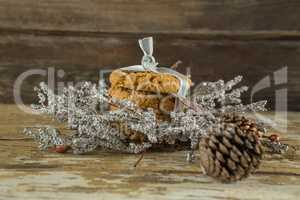 Cookies with christmas decoration arranged on wooden plank