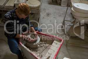 Male potter making a pot