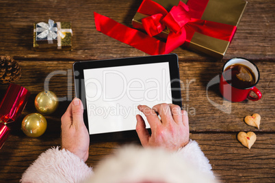 Santa Claus using digital tablet