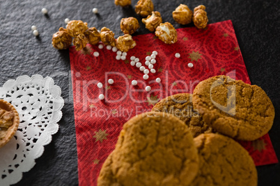 Cookies with pearls on red place mat