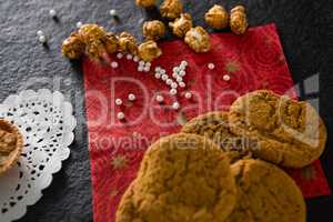 Cookies with pearls on red place mat