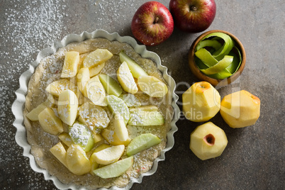Slice of apple on tart with icing sugar