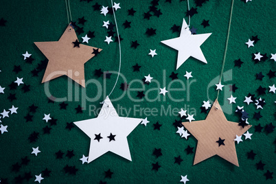 Handmade stars on green background