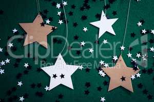 Handmade stars on green background