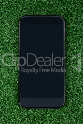 Mobile phone on artificial grass