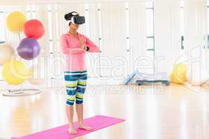 Woman performing while using virtual reality headset