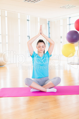 Woman performing yoga in the gym