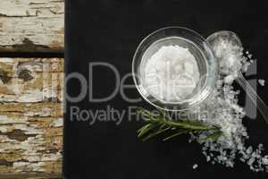 Salt in glass bowl and rosemary herb