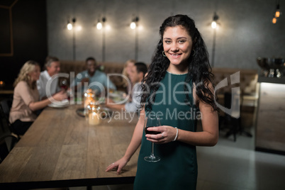 Portrait of beautiful woman holding wine glass