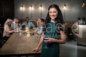 Portrait of beautiful woman holding wine glass