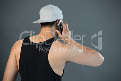 Rear view of man talking on mobile phone