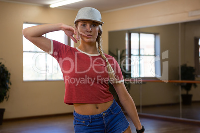 Portrait of beautiful woman practicing dance in studio