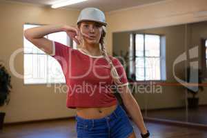 Portrait of beautiful woman practicing dance in studio