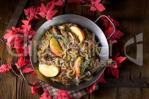 Fried liver with onion apple and herbs.