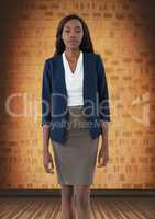 Businesswoman standing in orange brick room