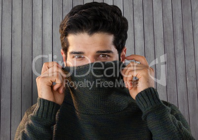 Man against wood with warm jumper