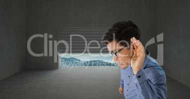 Businessman listening to nature through gap