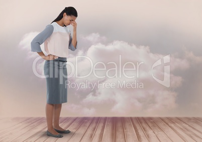 Businesswoman looking disappointed and down with clouds
