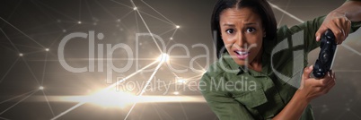 woman playing with computer game controller with light connections on green hills background