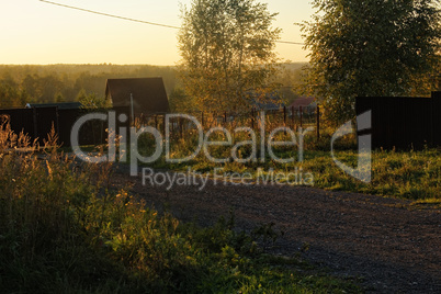 street of a country village in the evening in autumn