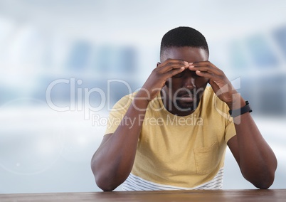 Businessman at desk with bright background