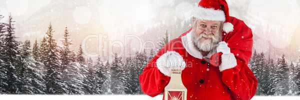 Santa with Winter landscape holding lantern and sack