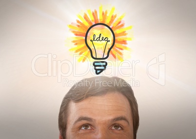 man looking up at light bulb idea