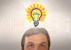 man looking up at light bulb idea