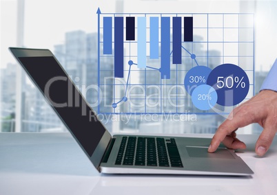 Businessman at desk with laptop and bar chart grid