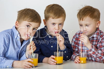 Children drinking fruit juice