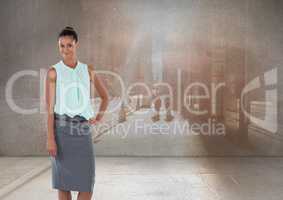 Businesswoman standing with hand on hip in front of city