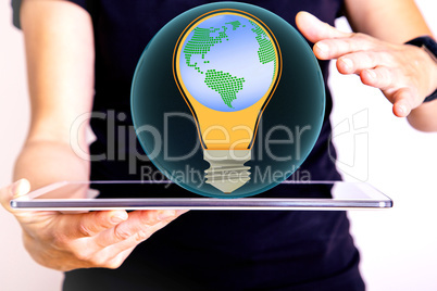 Man holding tablet pc with glass ball and light bulb