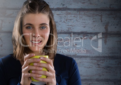 Woman against wood with cup