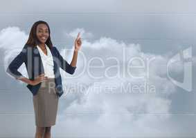 Businesswoman pointing with clouds