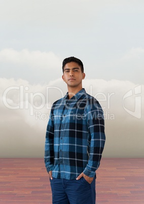 Businessman standing proud with clouds
