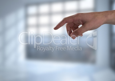 Hand interacting and pointing with bright window background