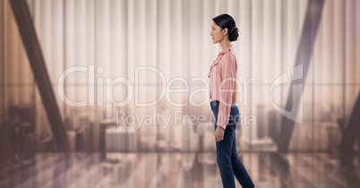 Businesswoman standing elegantly by soft light windows over city