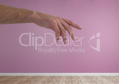 Hand reaching in pink room