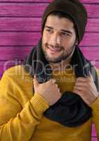 Man against wood with warm scarf and hat