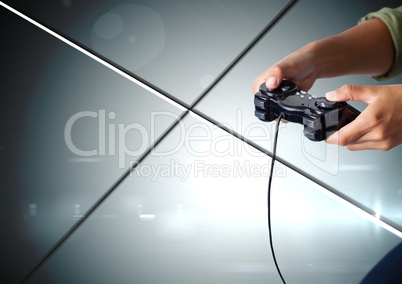Hands playing with computer game controller with geometric minimal shiny lines background