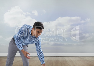 Businessman reaching hands with clouds