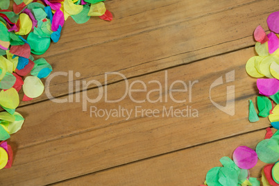 Confetti on wooden surface