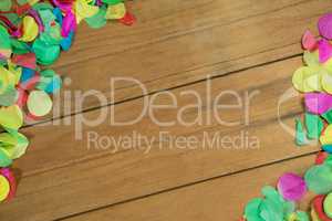 Confetti on wooden surface