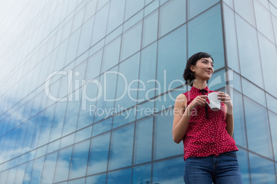 Female executive having coffee