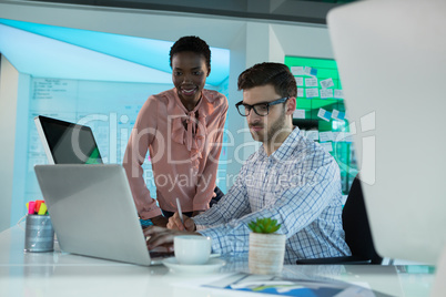 Executives working together at desk