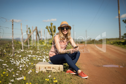 Woman using mobile phone on a sunny day