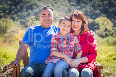 Mixed Race Caucasian and Hispanic Family At The Park.