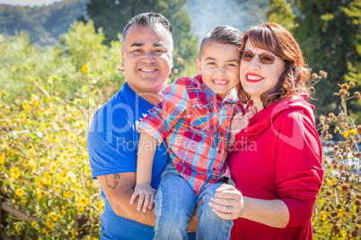 Mixed Race Caucasian and Hispanic Family At The Park.