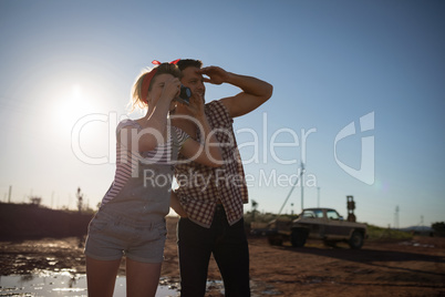 Couple taking a photo with a camera